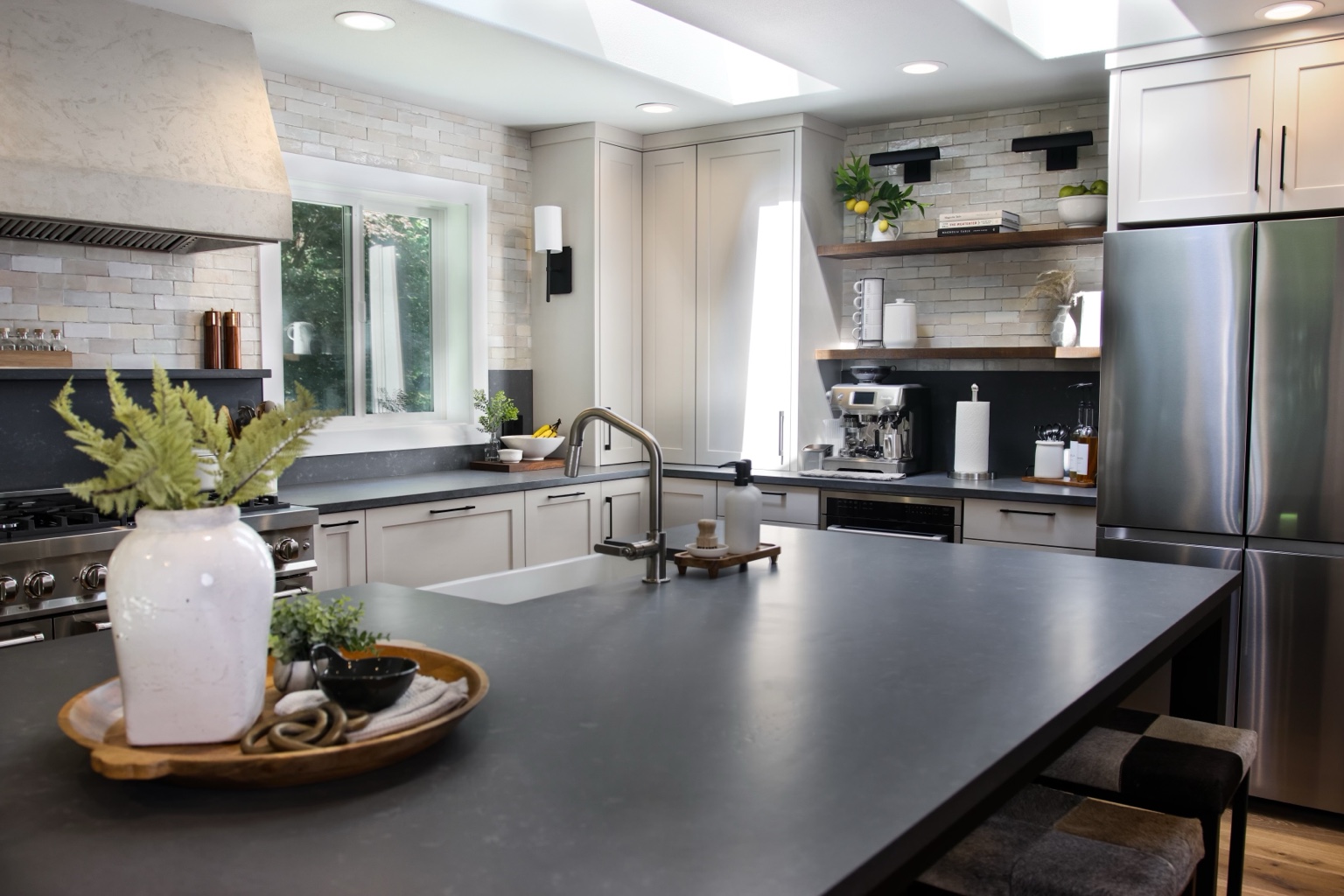 Alternate view of the kitchen island, sink and cabinetry